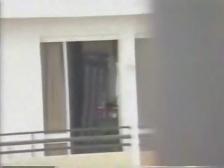 Naked neighbour filmed from across the jalan