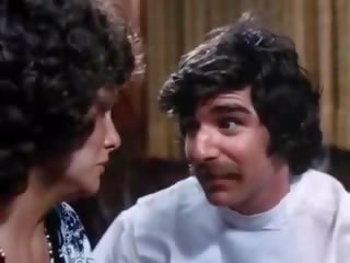 70s porn brunette gives deep Blowjob to a doctor